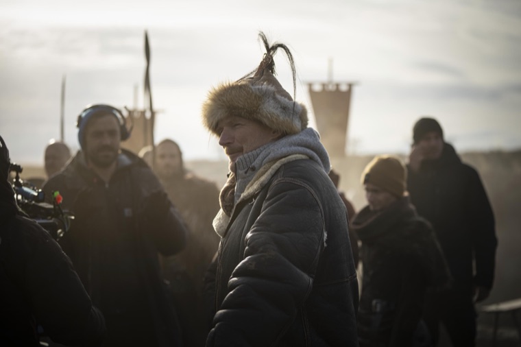 Fur hat and headphones at the British war camp, Jesse V. Johnson waiting on the light — Episode 5.