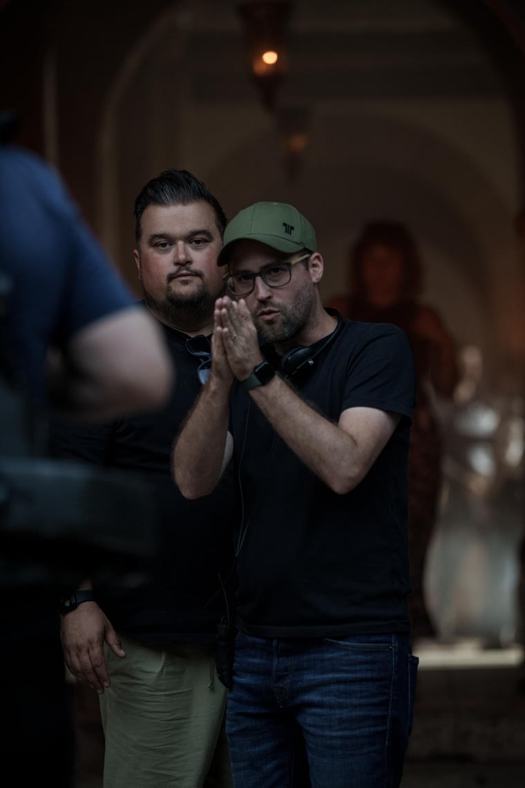 Ryan Whitaker and Kris Kimlin beside the lens at the villa in Maridunum — Tewdrig, Uther and Merlin in the courtyard — Episode 4.