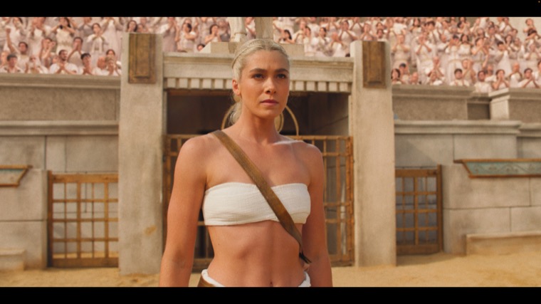 Charis (Rose Reid) takes the arena, the crowd chanting her name.