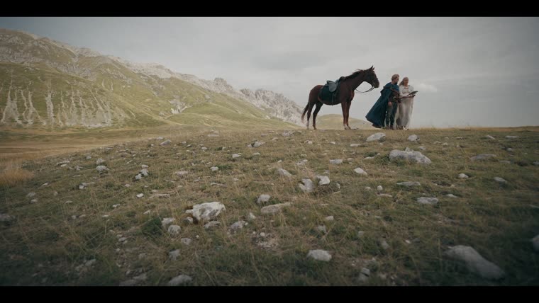 Taliesin (James Arden) and Charis (Rose Reid) on the road — “I was raised beyond those mountains.”