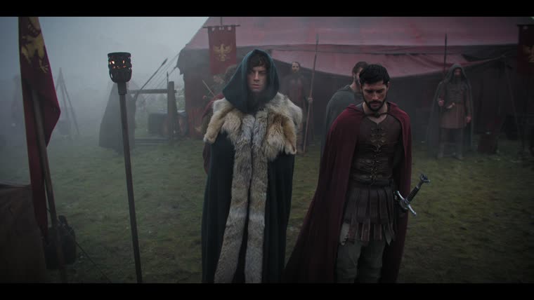Merlin (Tom Sharp) counts the odds for Aurelius (Finney Cassidy): “700 men is not a man too many to face Hengist.”