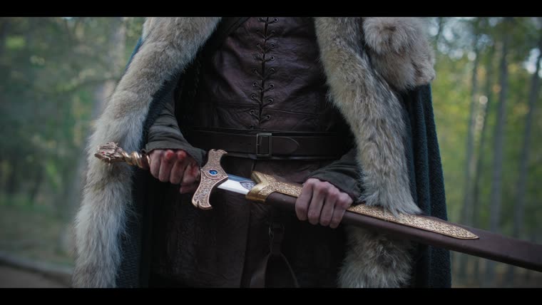 Bare hands, bloodied, drawing the Fisher King's Sword.