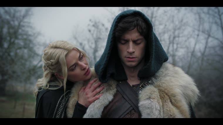 Morgian (Emree Franklin) at Merlin’s (Tom Sharp) shoulder: “They need you now. Feel the power in your arm.”